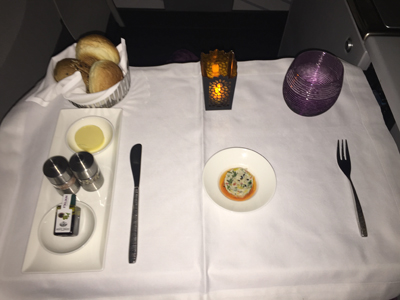 business class flight from Bali to Doha with Qatar Airways