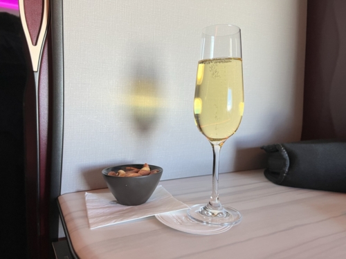 Qatar Airways Qsuite takeoff drink